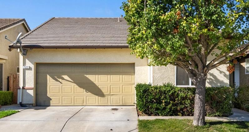 a view of a house with a garage