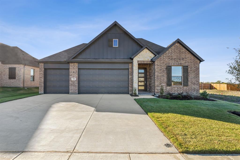 front view of a house with a yard