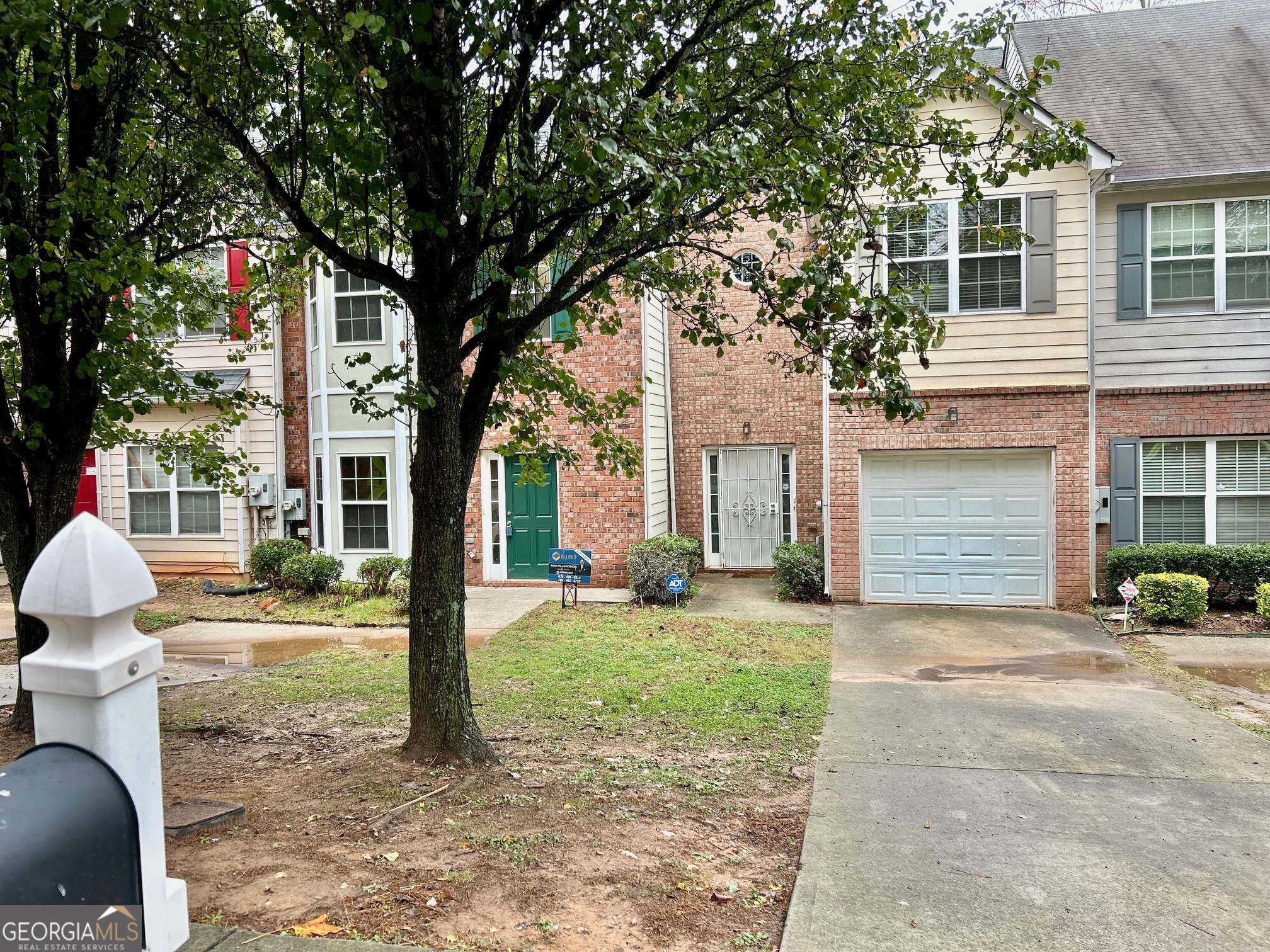 front view of house with a yard and seating space