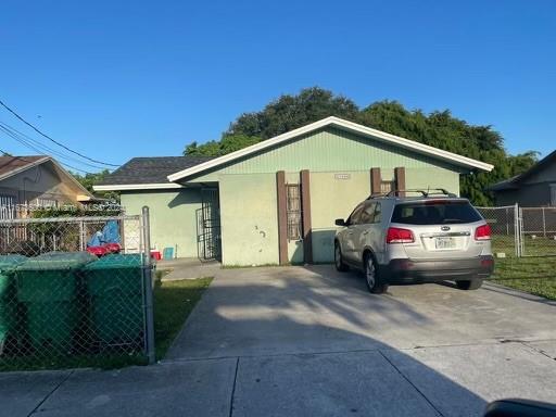 a view of a car park in front of house