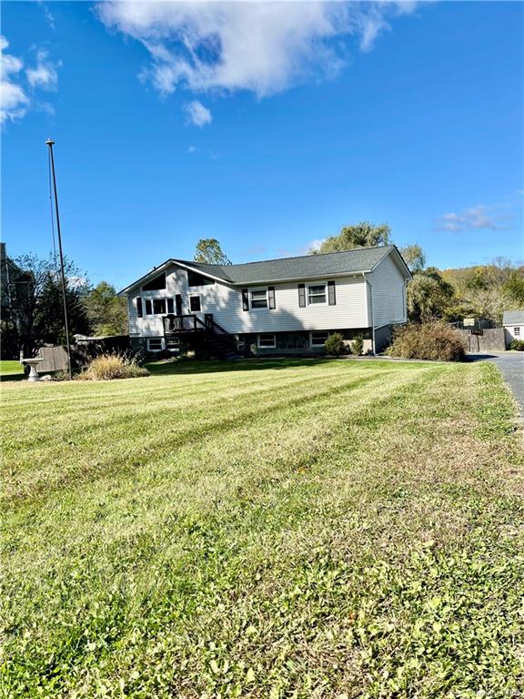 a view of a house with a big yard