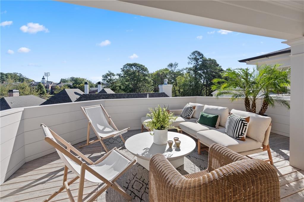 a view of a chairs and table in patio