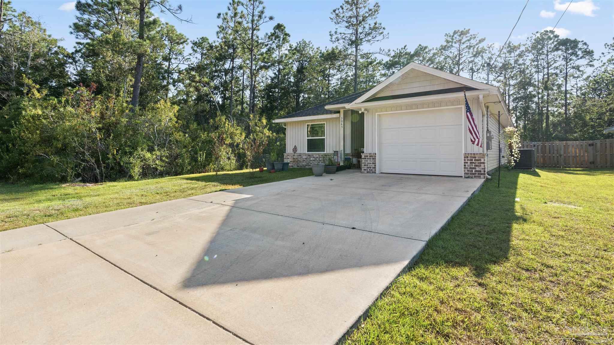 a front view of a house with yard