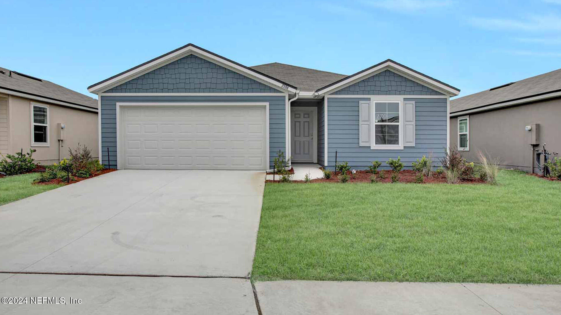 a front view of house with yard and green space