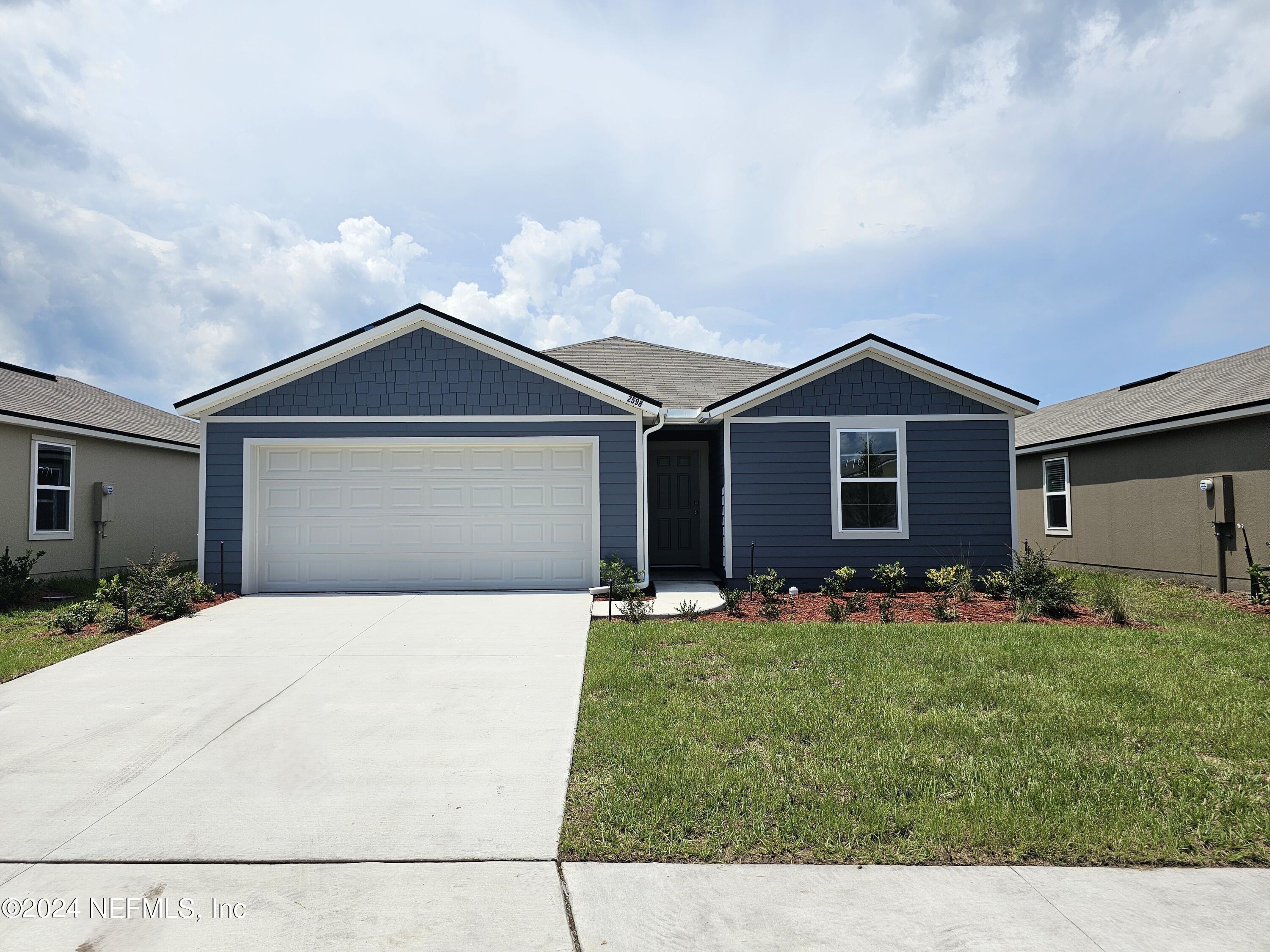 a front view of house with yard