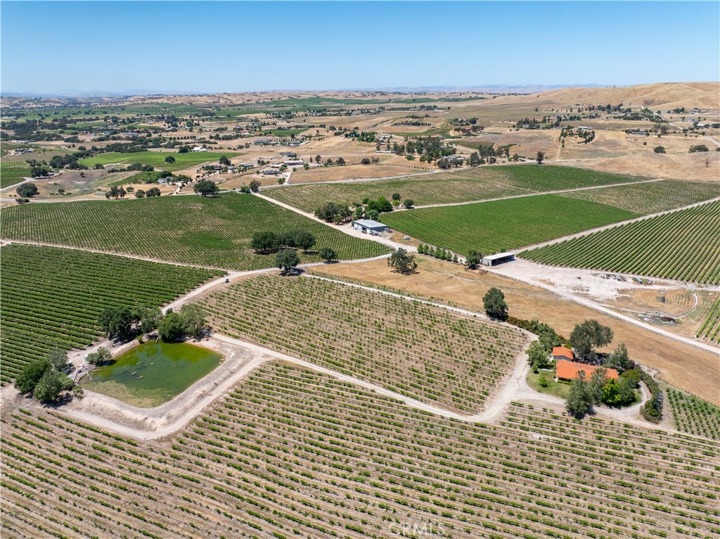 an aerial view of a houses with outdoor space