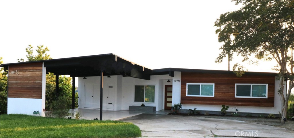 a backyard of a house with table and chairs