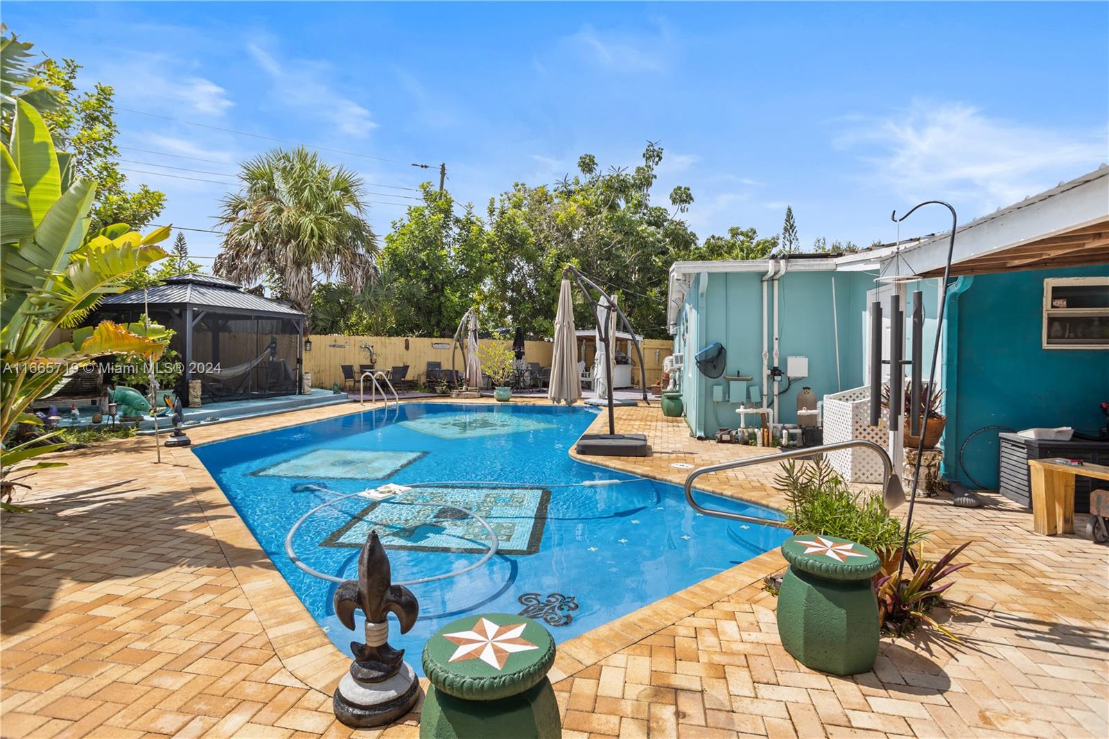 a view of a swimming pool with lounge chairs