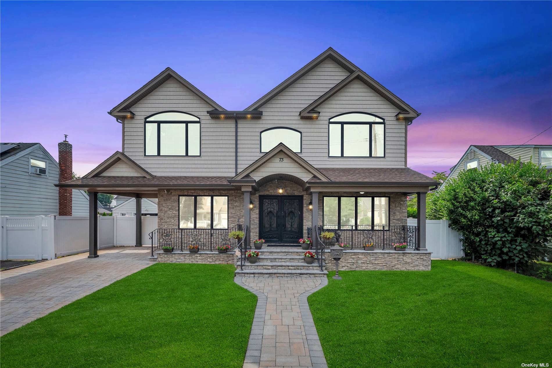 a front view of a house with garden