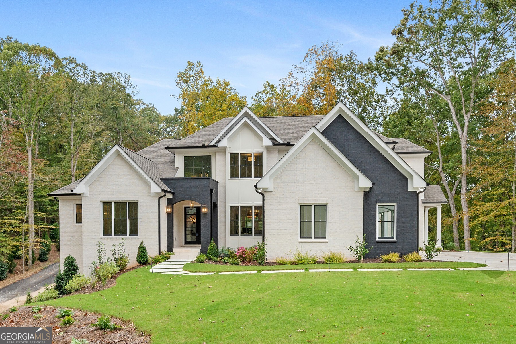 a front view of a house with a yard