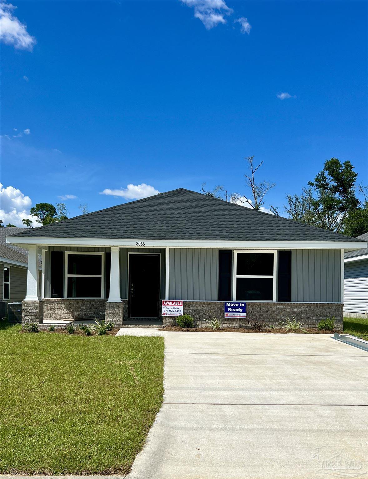 a front view of house with yard and outdoor seating