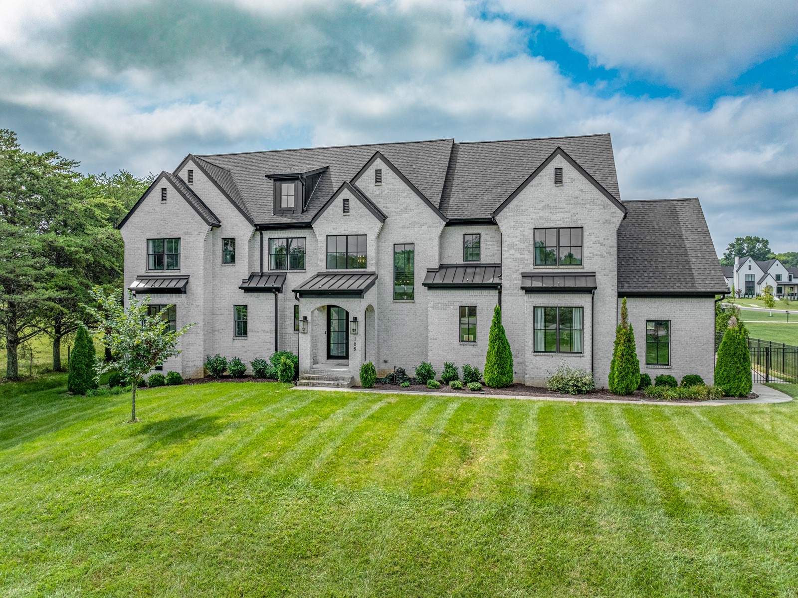 a front view of a house with a yard