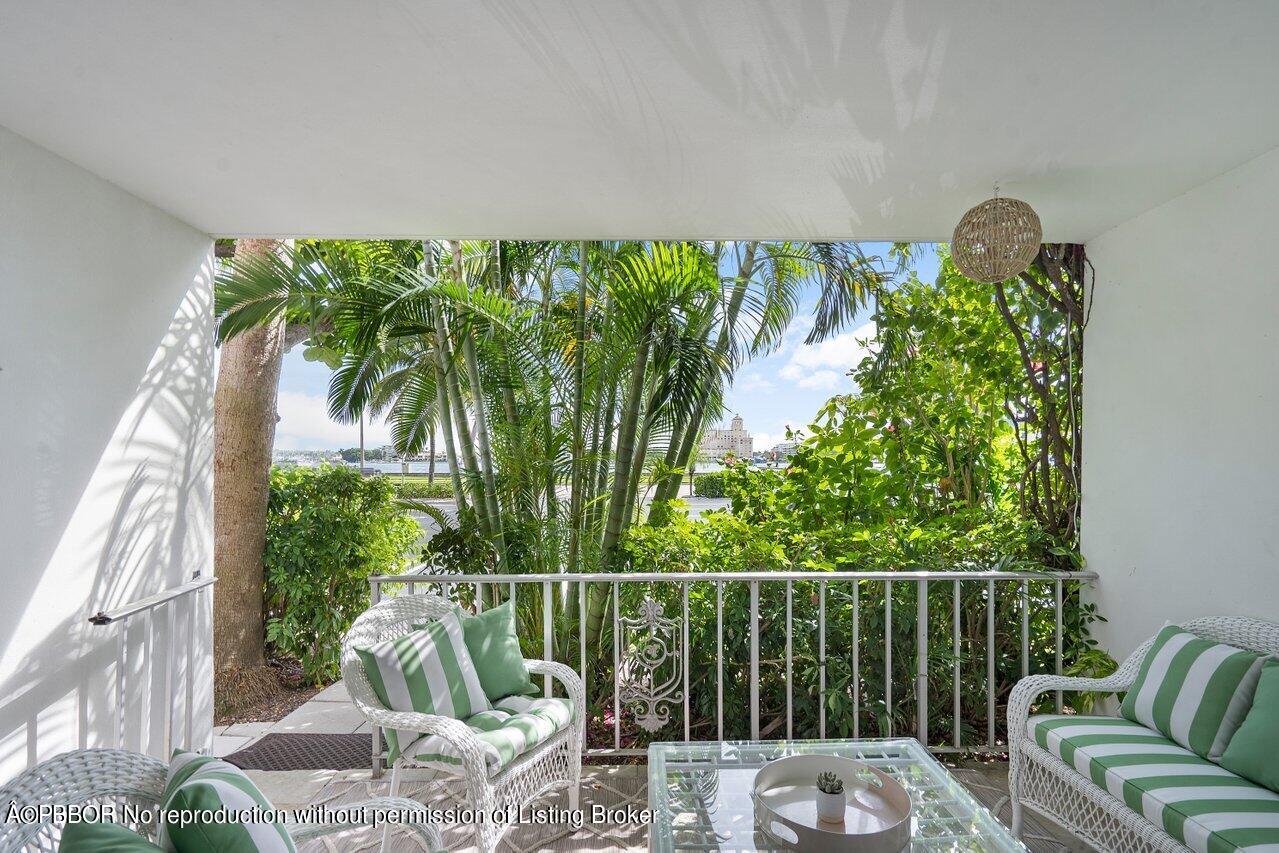 a balcony with outdoor space and sitting area