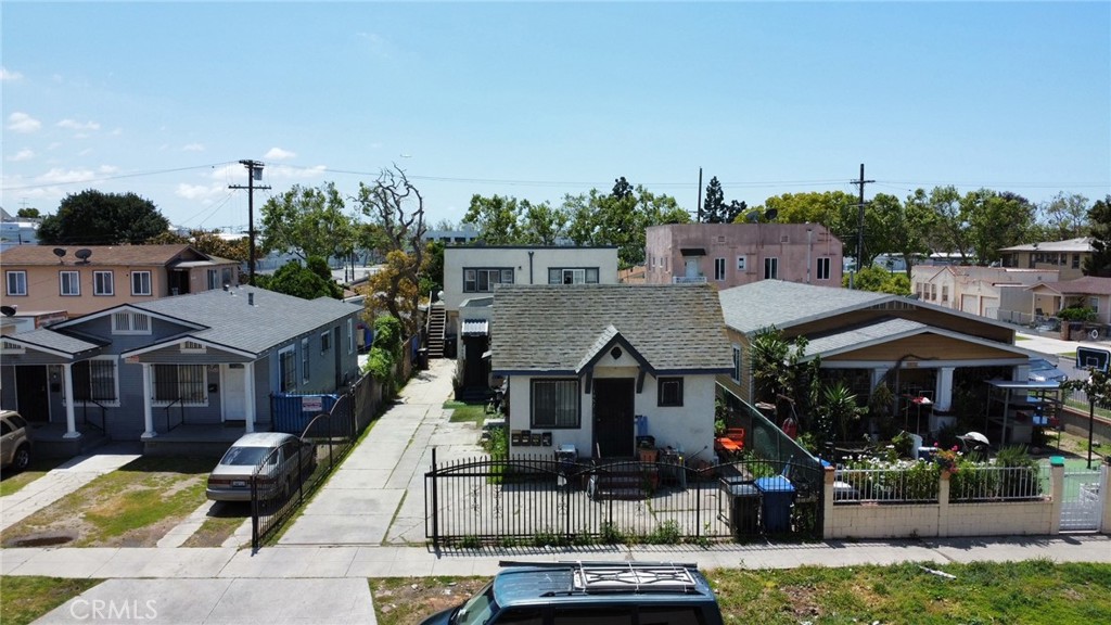 a aerial view of a house with swimming pool and furniture