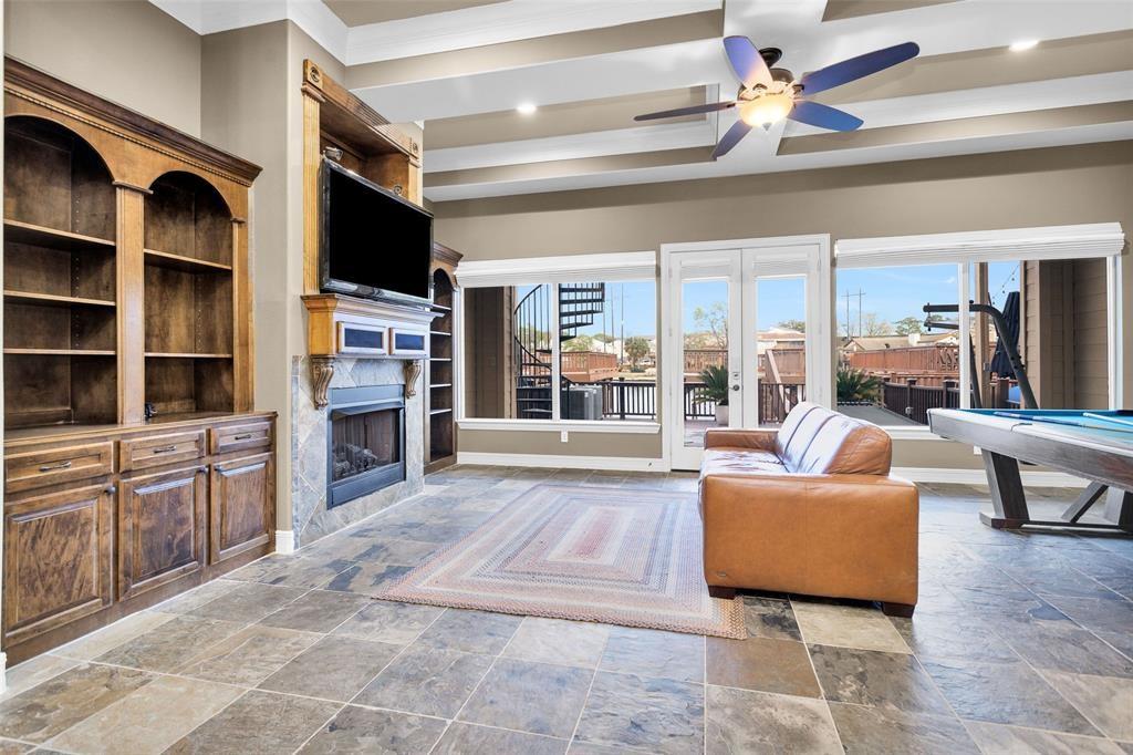 a living room with fireplace furniture and a flat screen tv