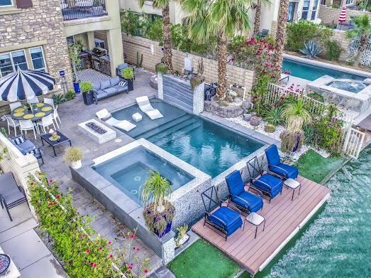 a view of a backyard with plants and a patio