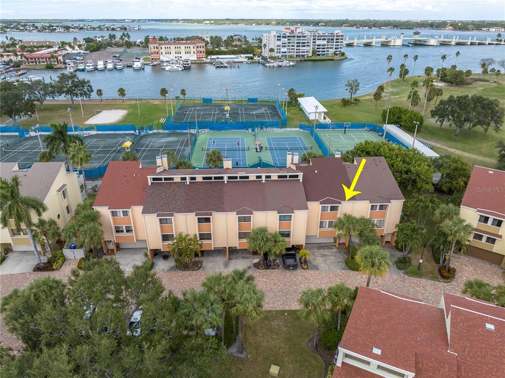 an aerial view of house with yard lake and ocean view