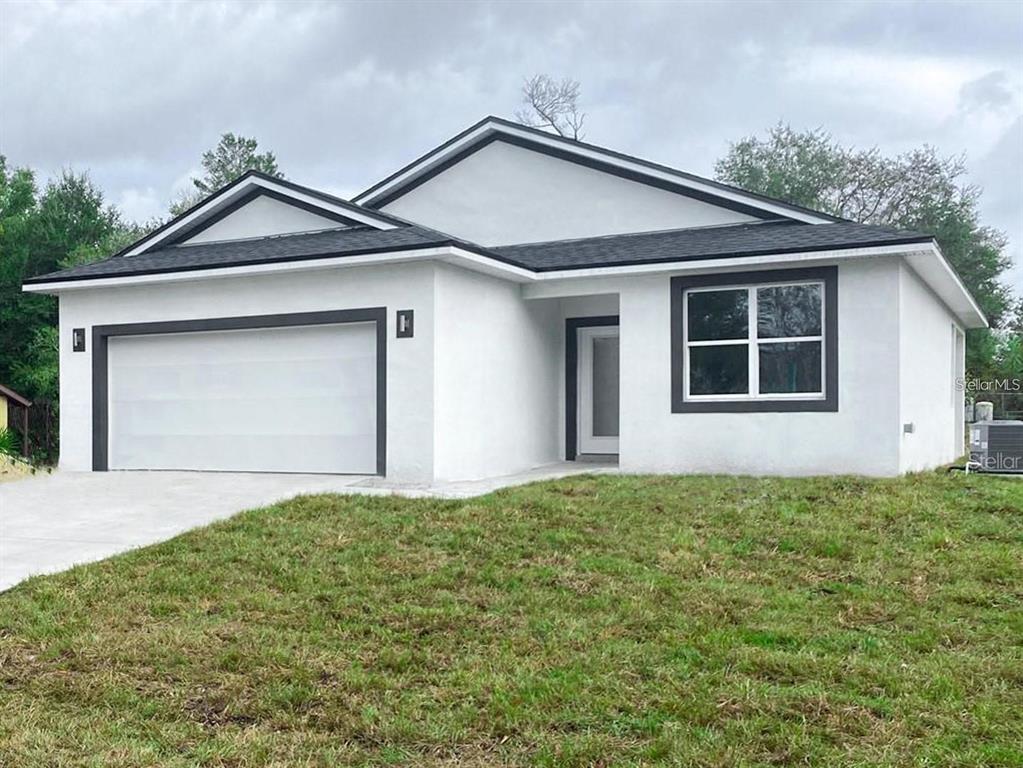 a front view of a house with garage