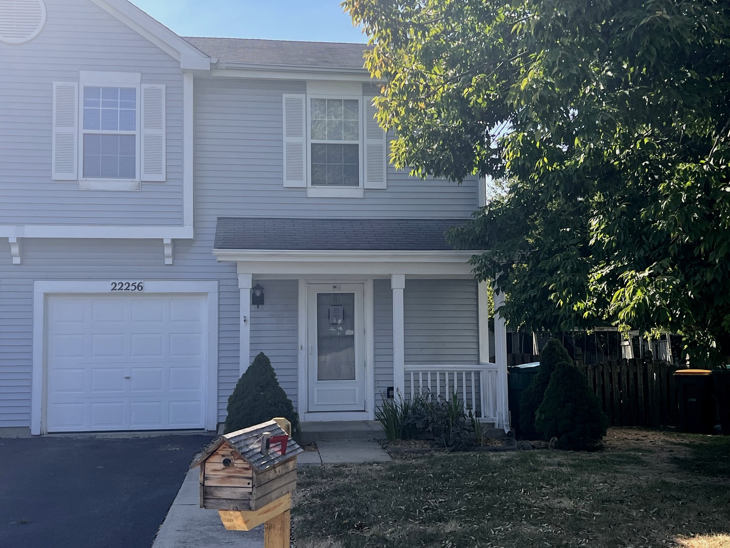 front view of a house with a yard