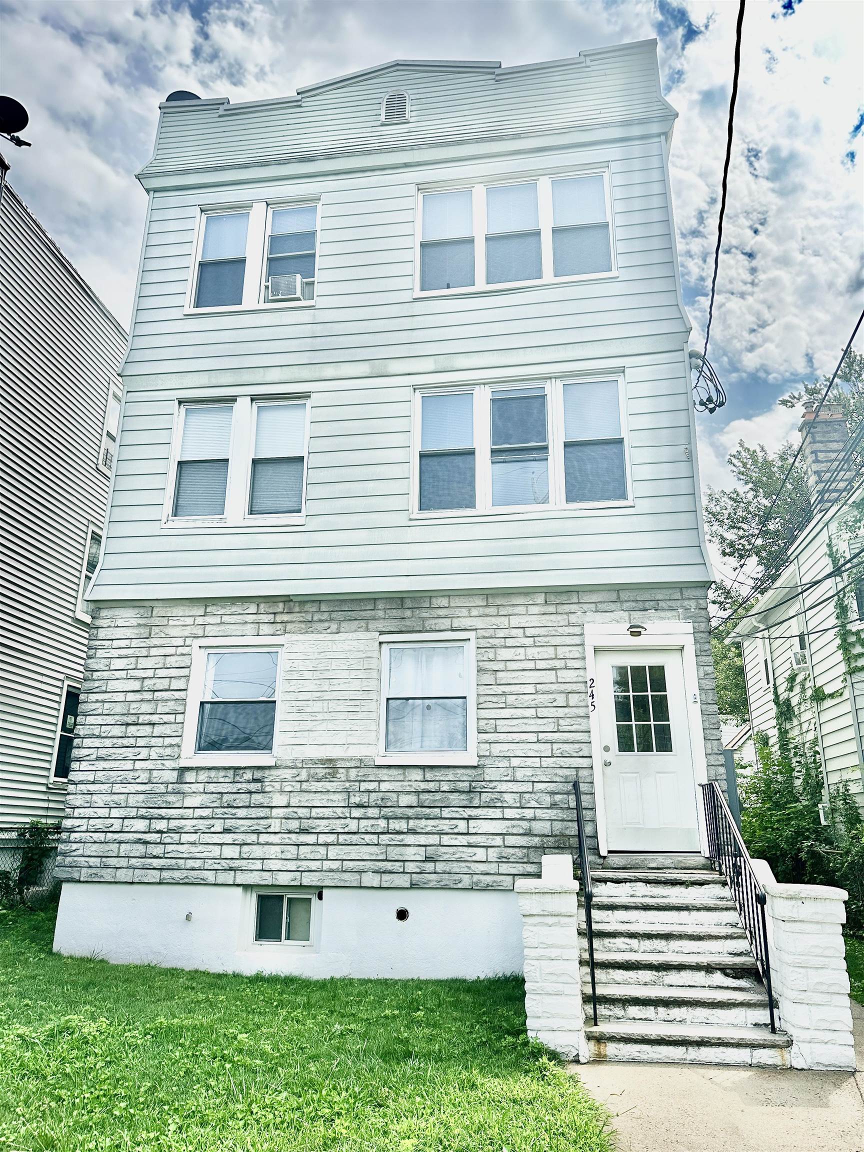 a view of a house with a small garden