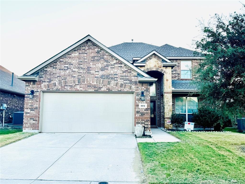 front view of a house with a garden