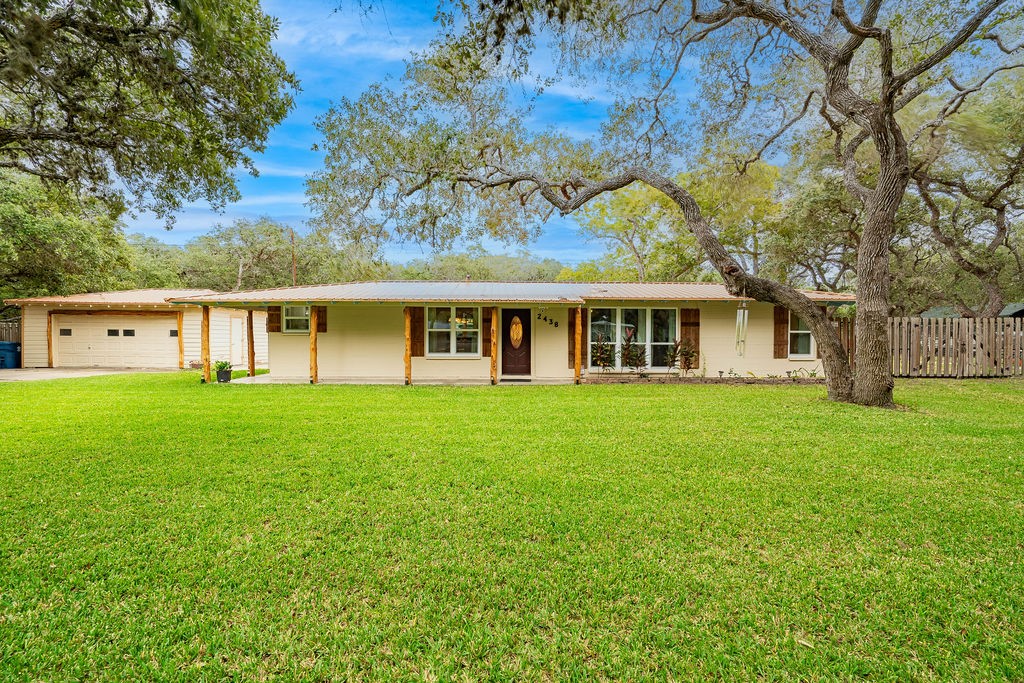 front view of a house with a yard