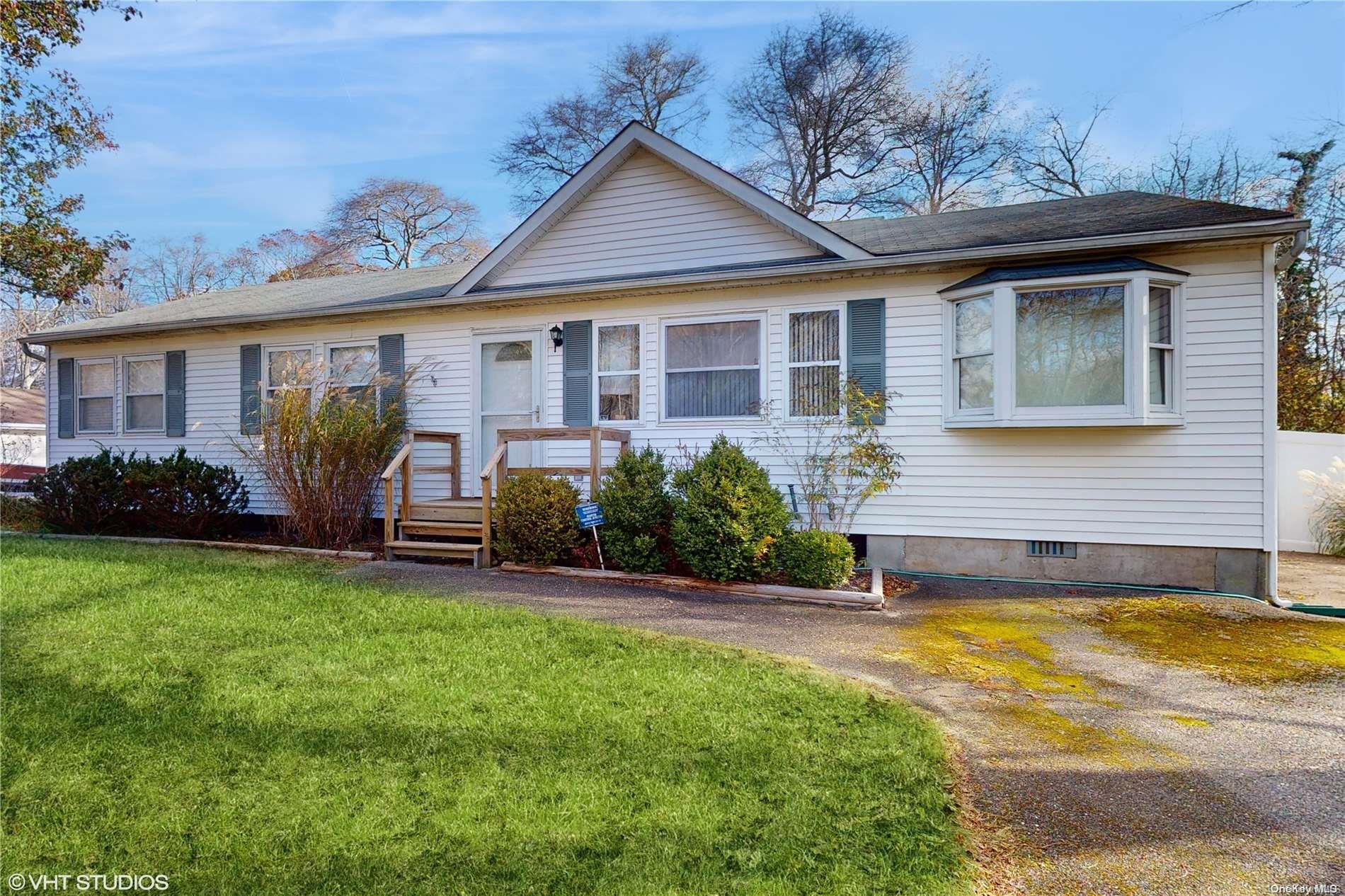 a view of a house with a yard patio and a patio