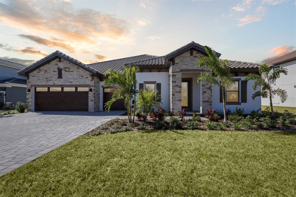 front view of a house with a yard