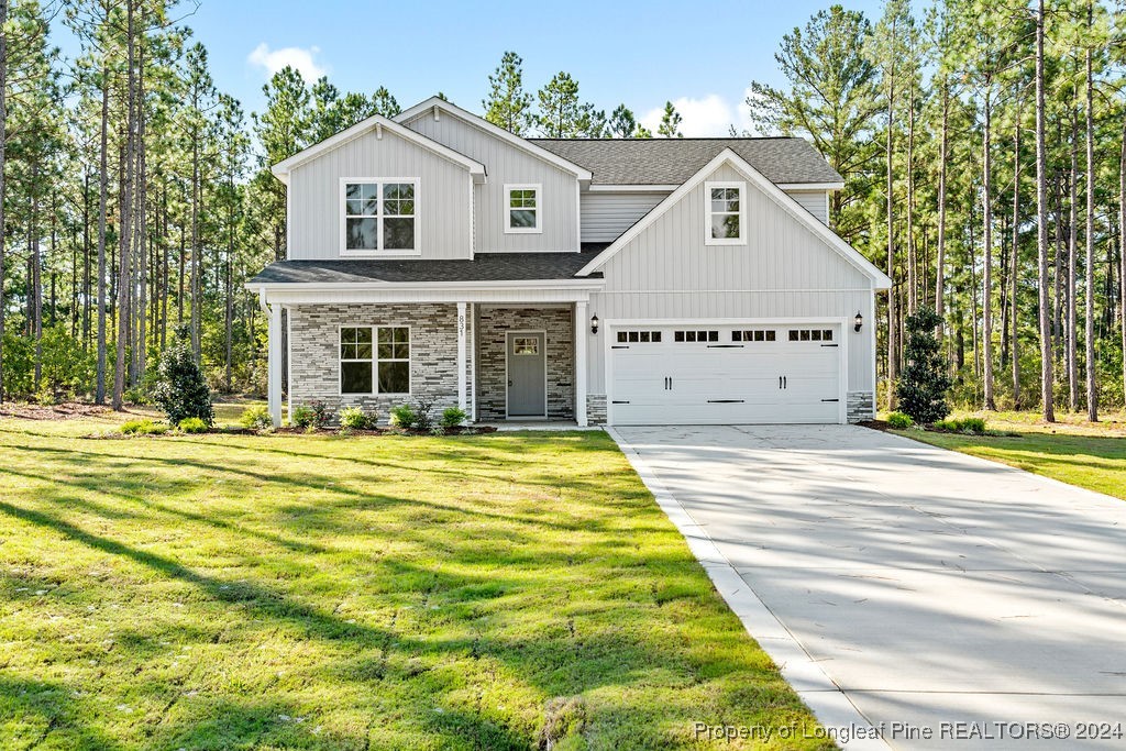 a view of house with yard and entertaining space