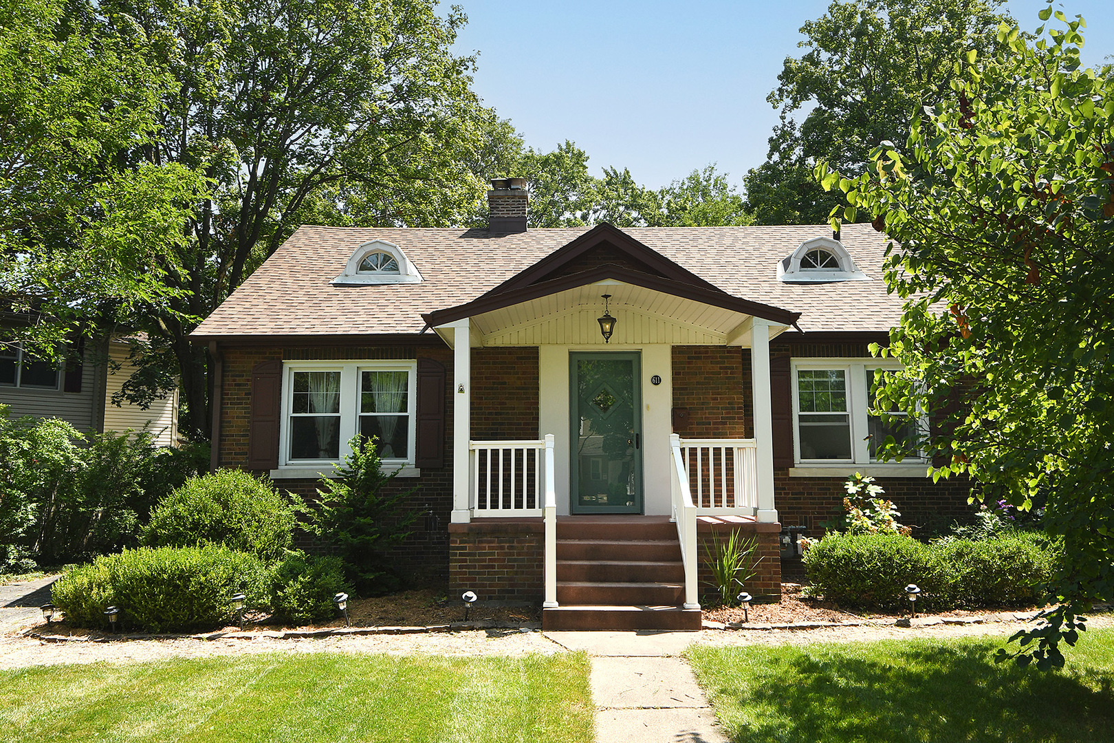 front view of a house with a yard