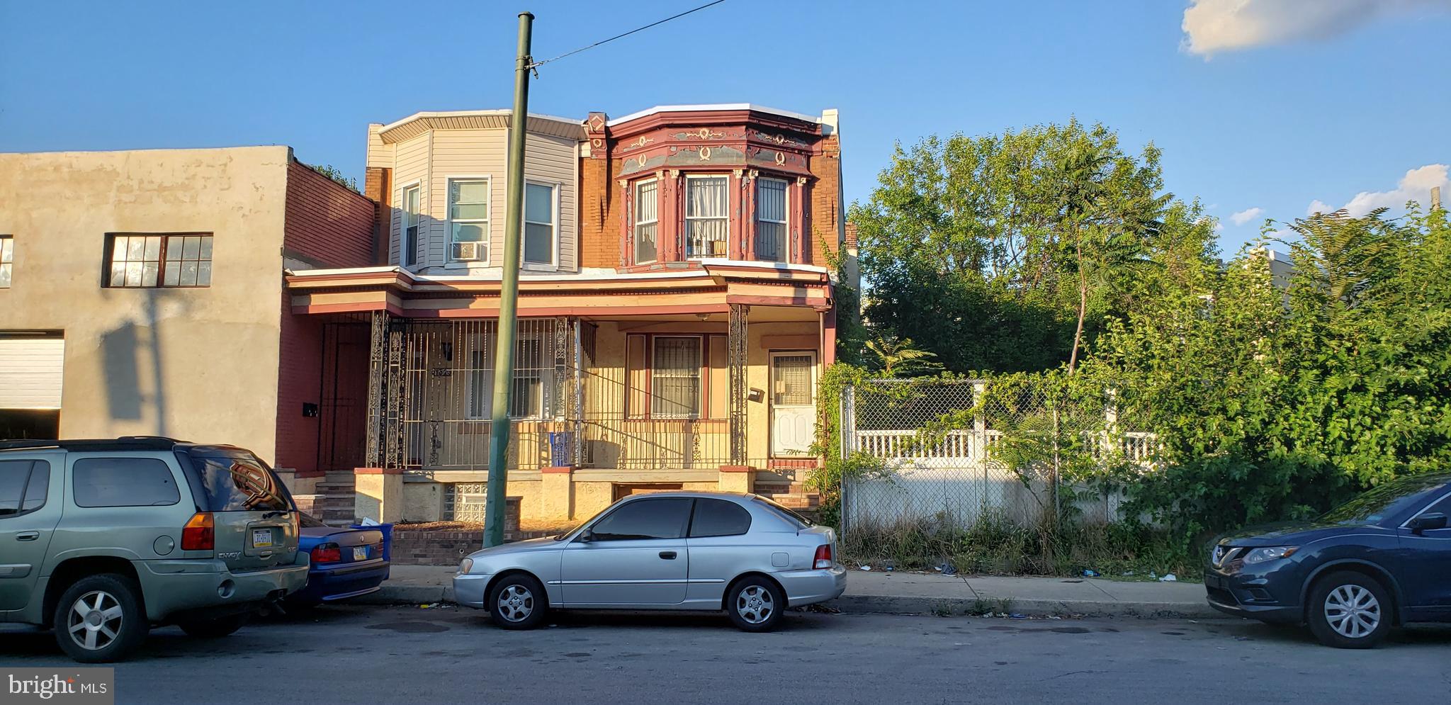 a view of a car parked in front of a house