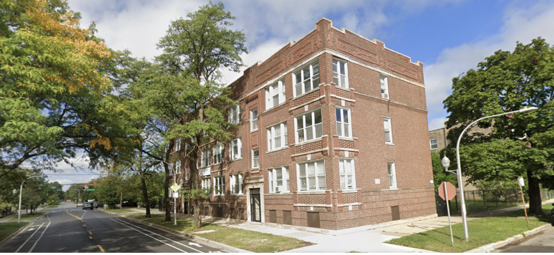 a front view of a building with street view