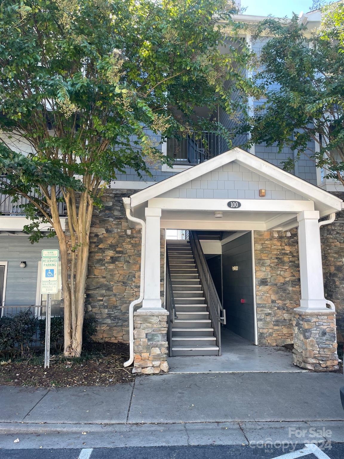 a front view of a house with garage