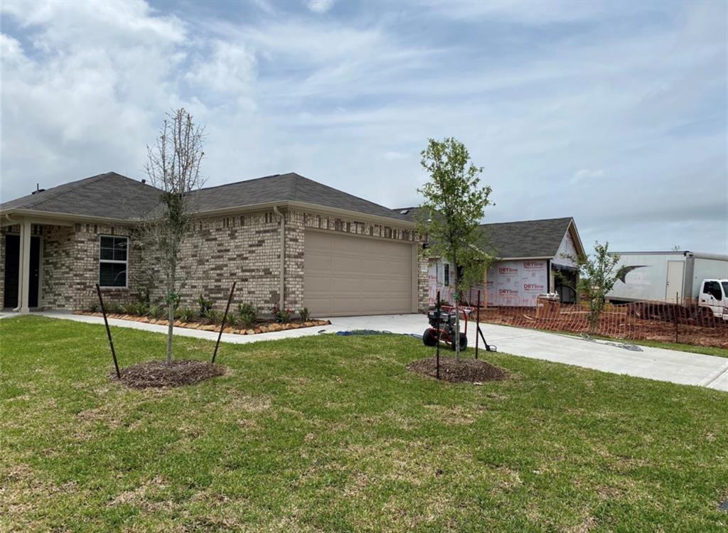 a house view with a sitting space and garden