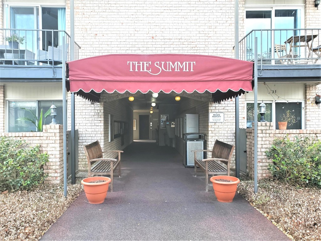 a view of a cafe with sitting area