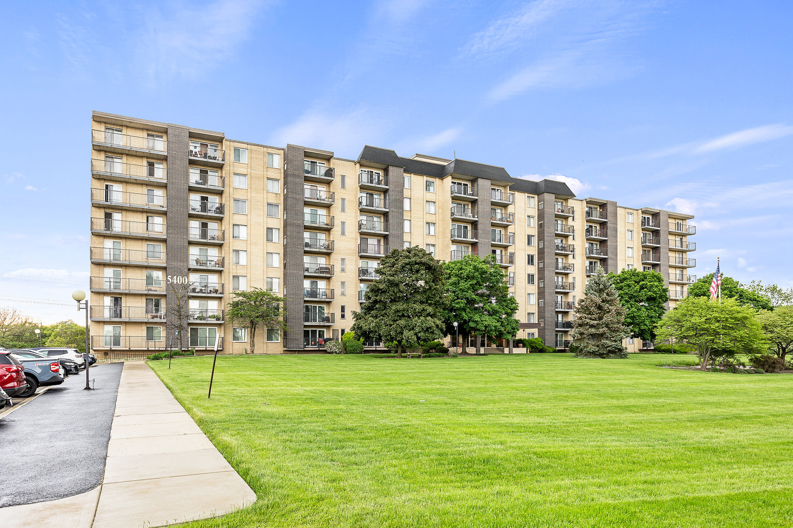 a view of a big building with a yard