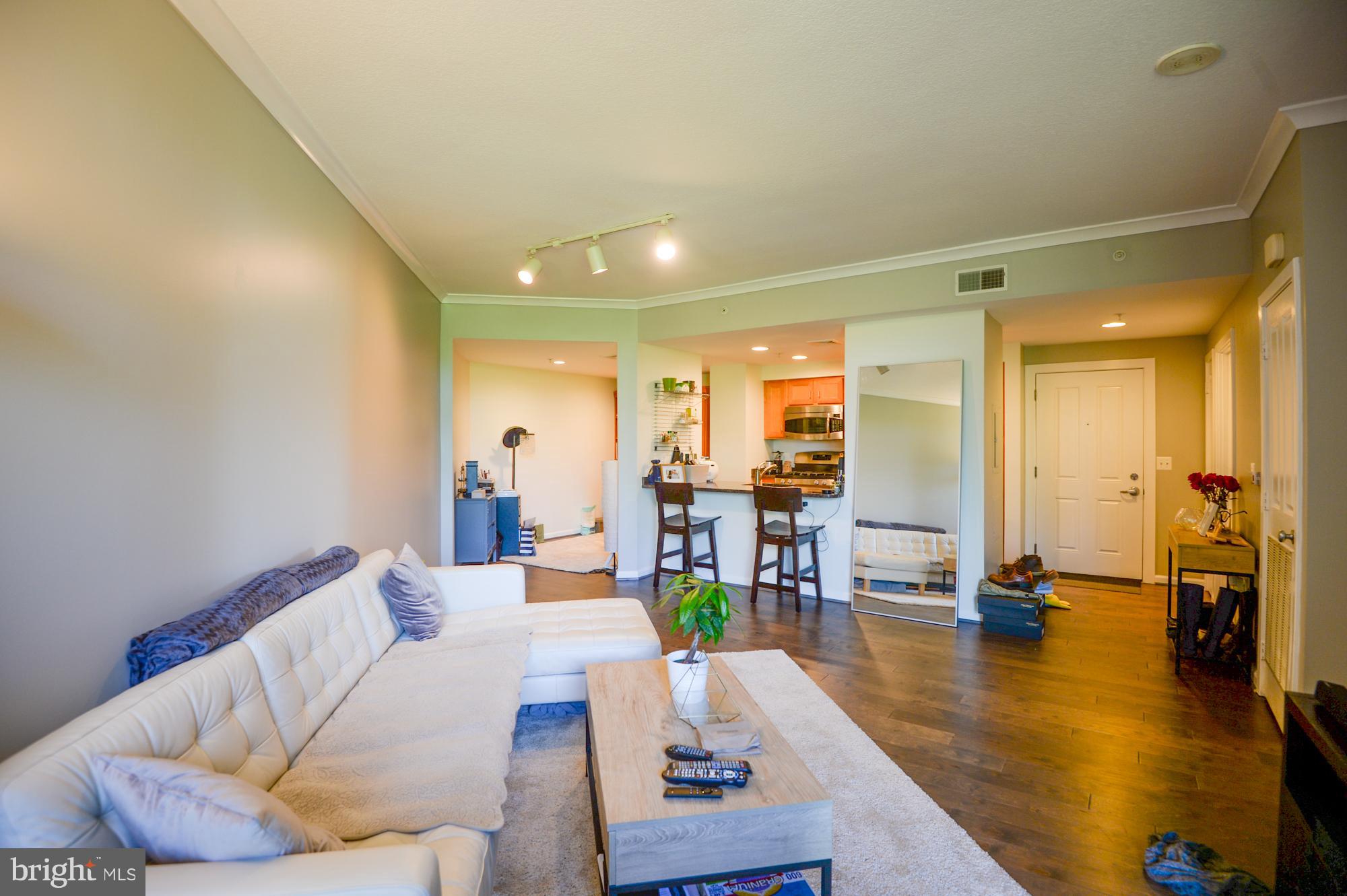 a living room with furniture and a table