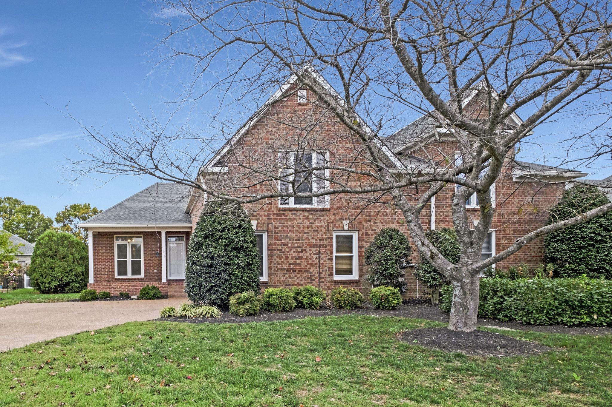 front view of a house with a yard