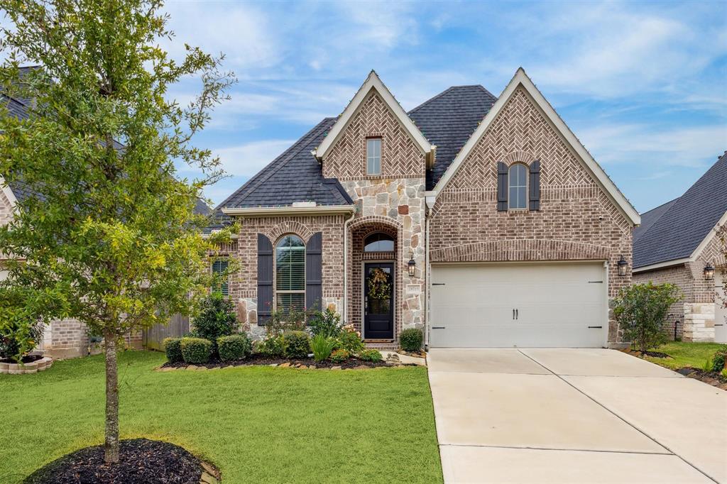 Beautiful view of 28715 Bella Leigh Court gated in Firethorne! 4 BR/3 bath - 2476 sf