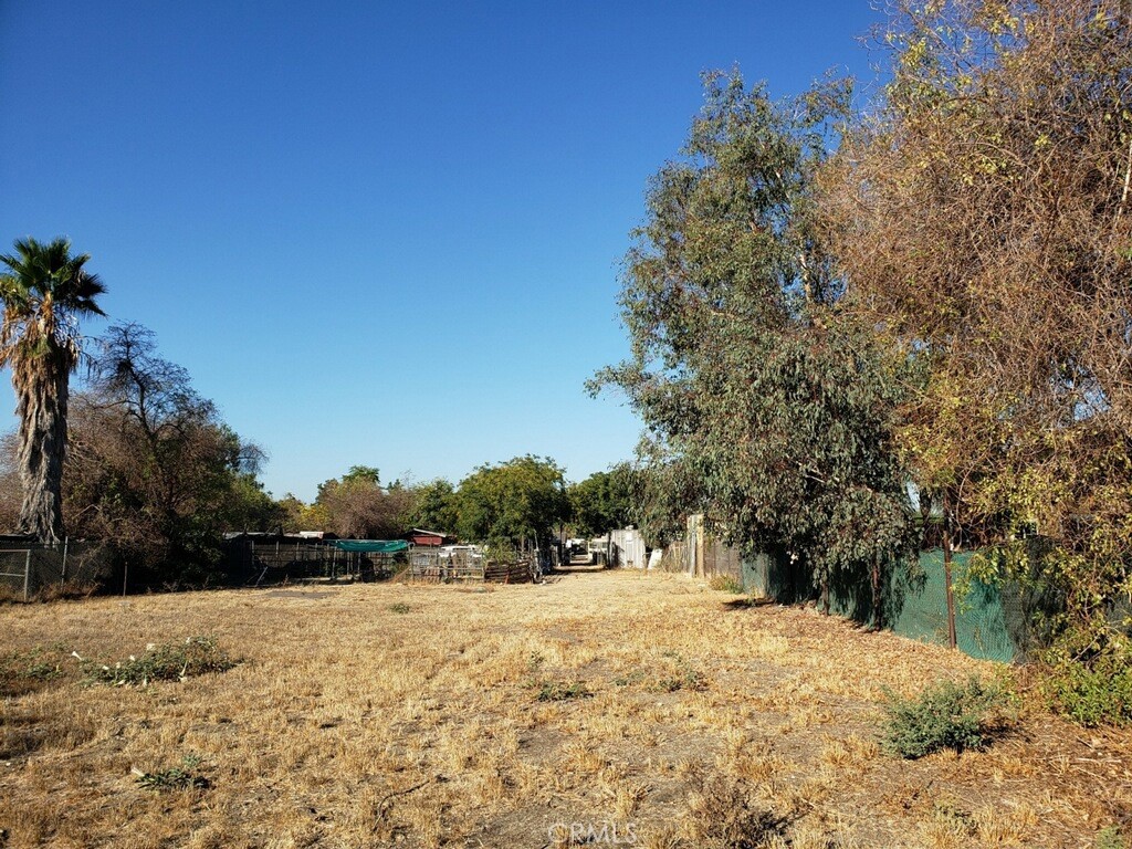 a view of dirt yard and mountain view