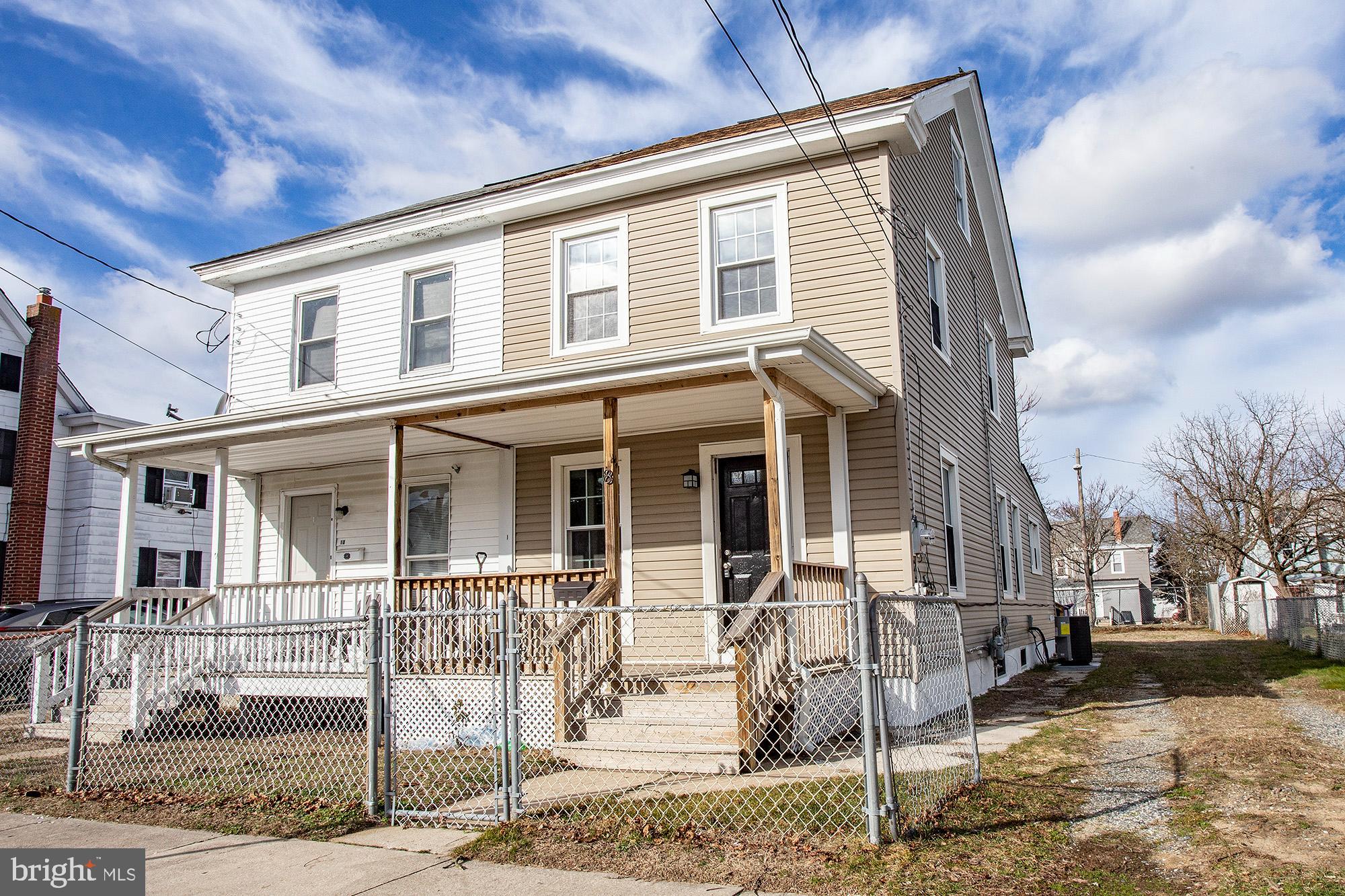 front view of a house with a street