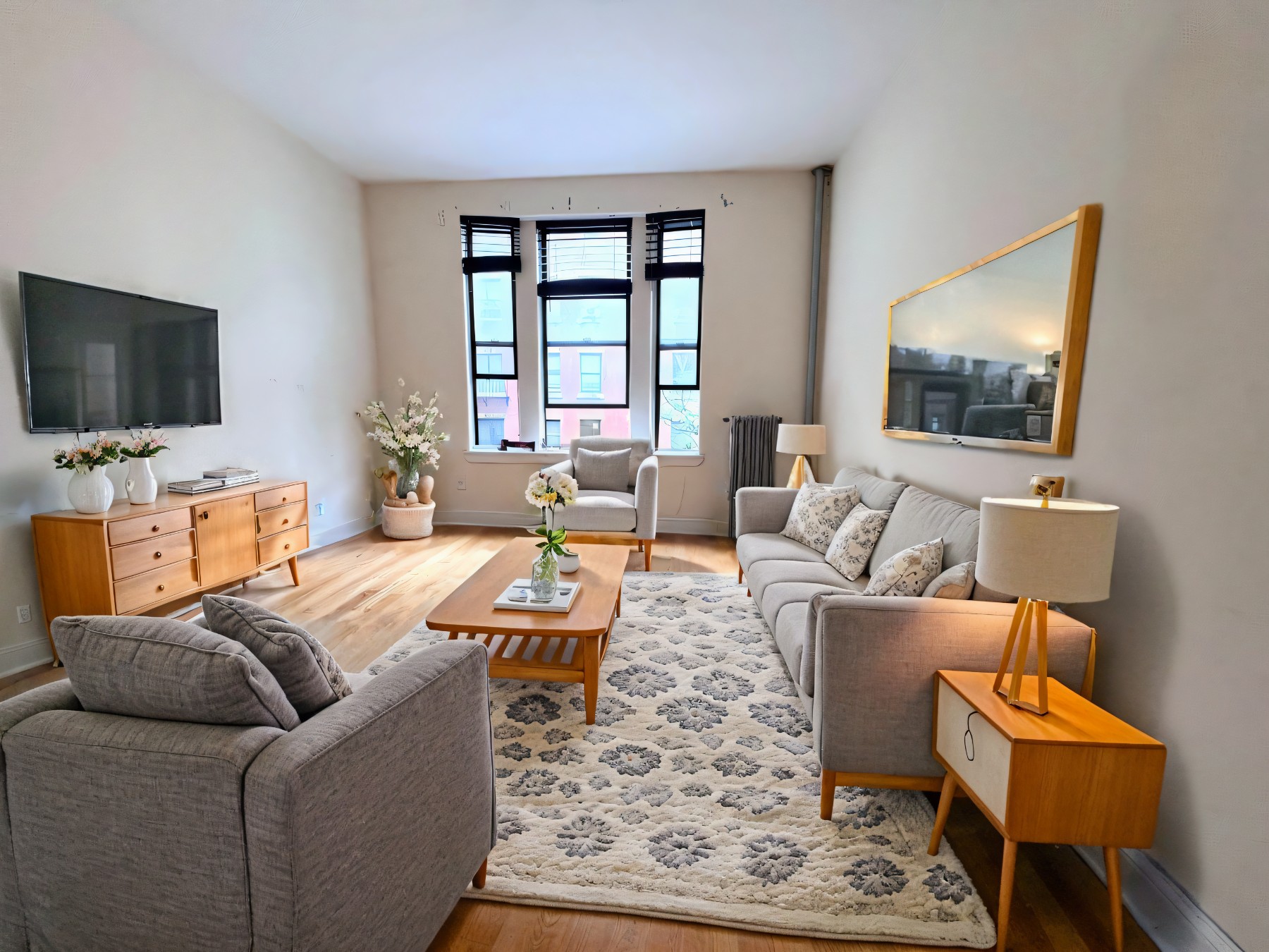 a living room with furniture and a flat screen tv