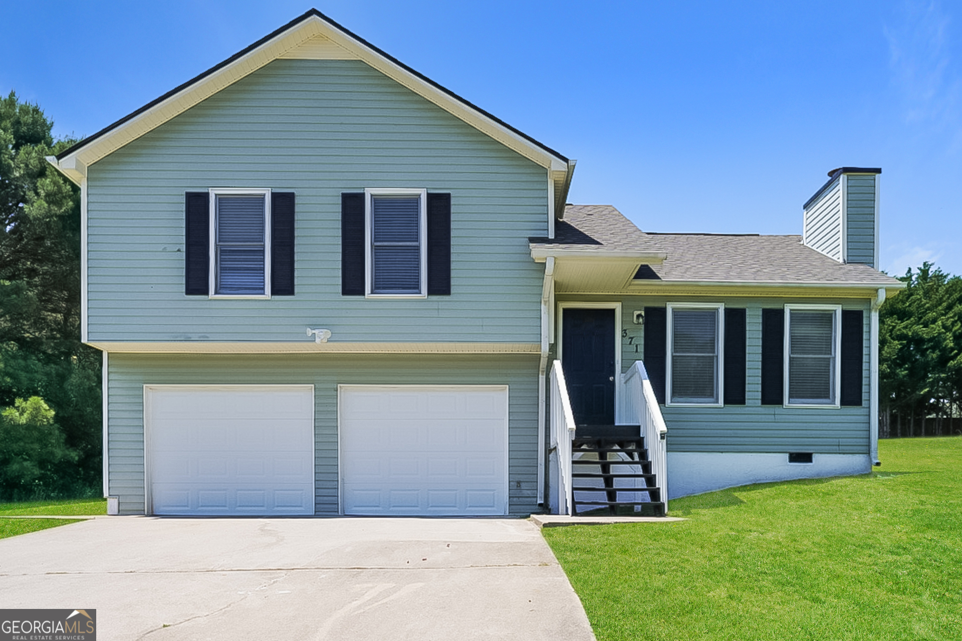 front view of a house with a yard