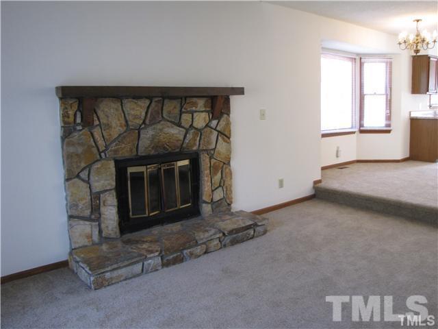 a living room with a fireplace