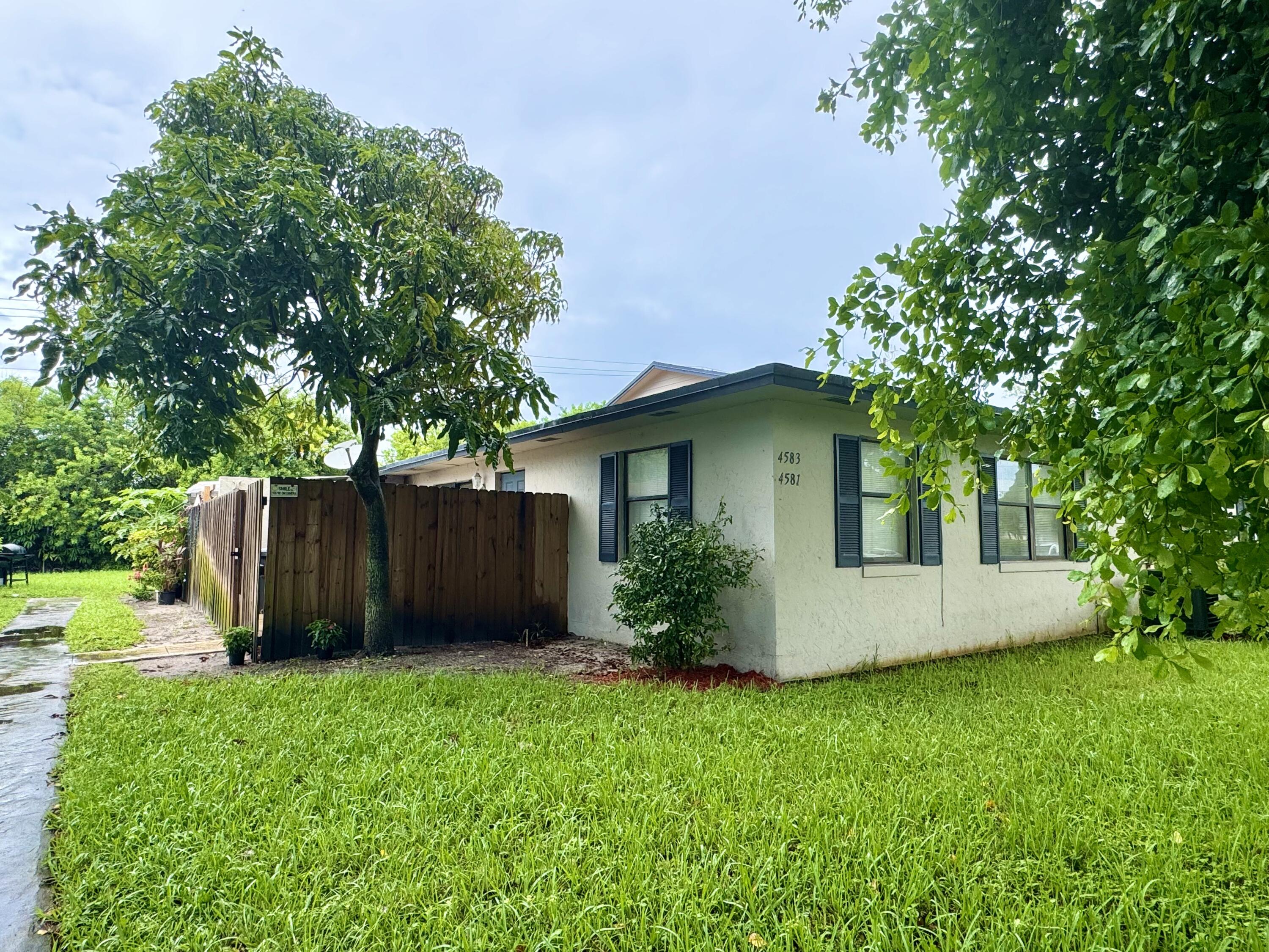 a view of a house with a garden