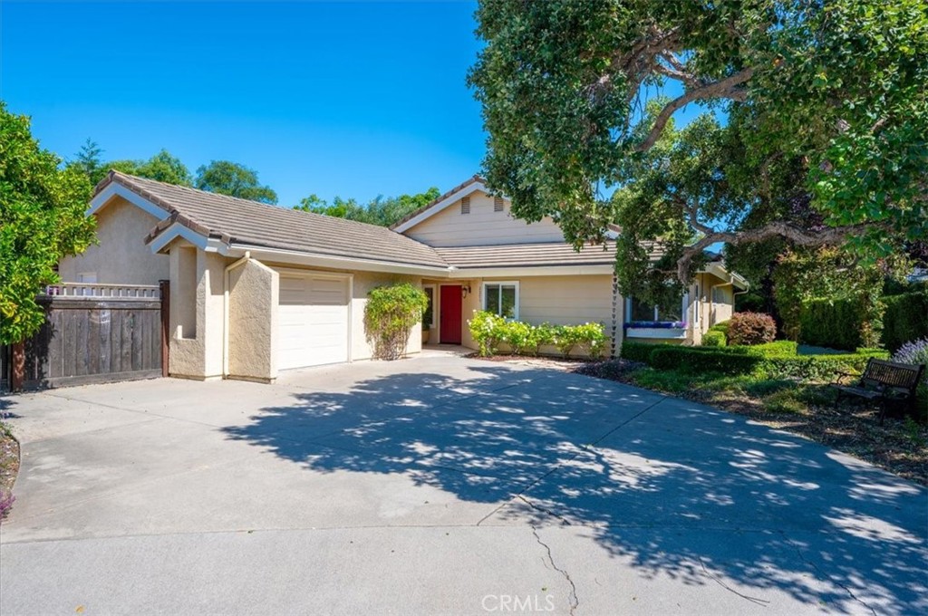 a front view of a house with a yard and a garage