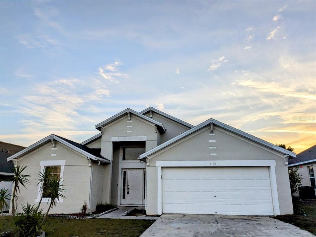 a front view of a house with garage