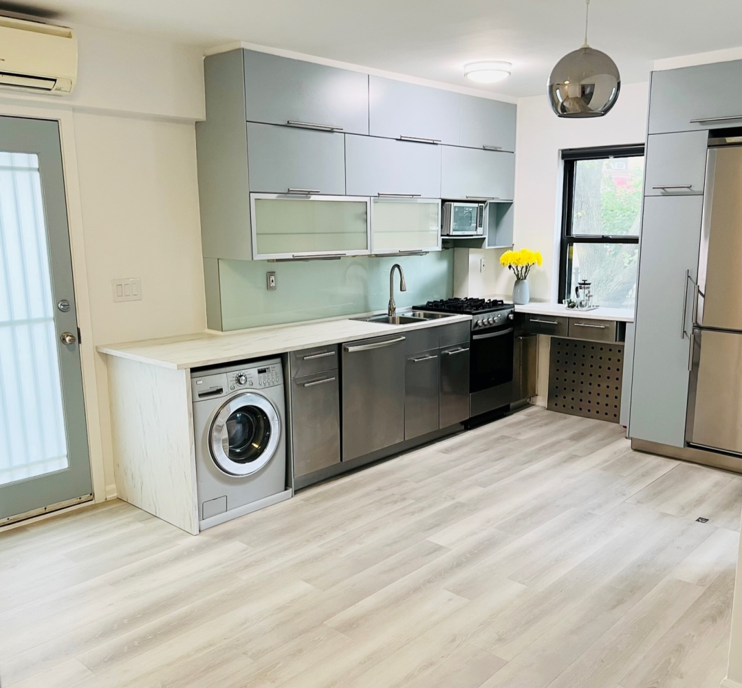 a kitchen with a stove a sink and a refrigerator