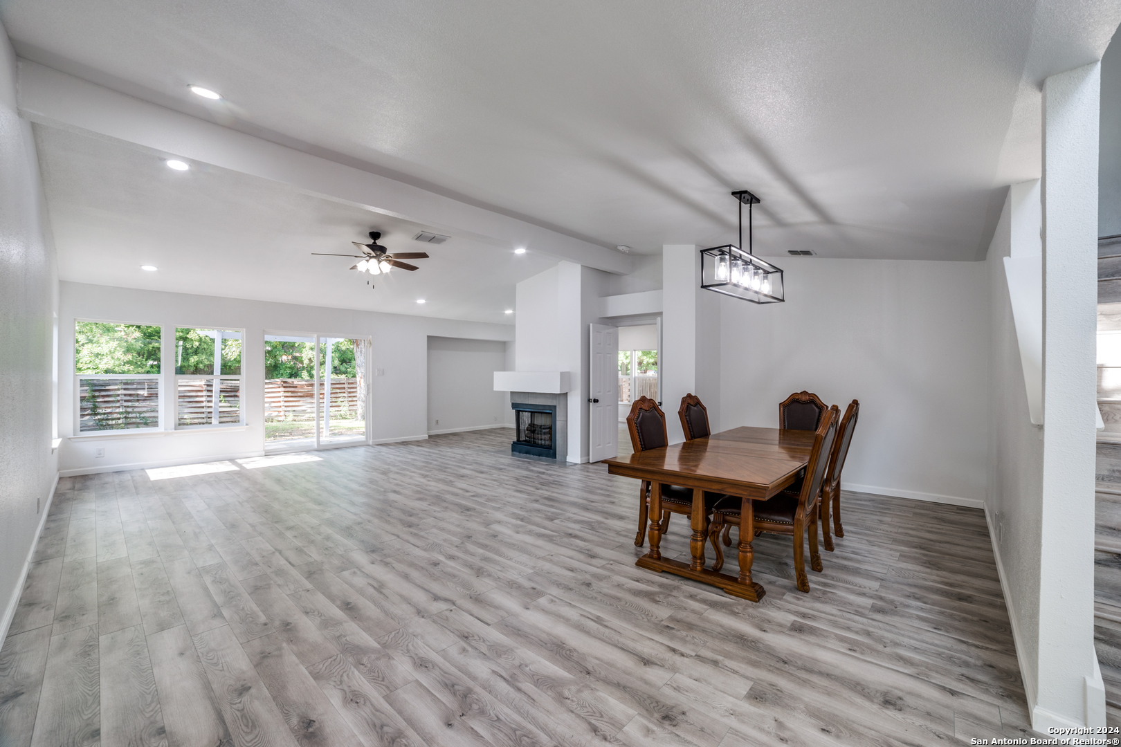 a view of a dining room with furniture window and wooden floor