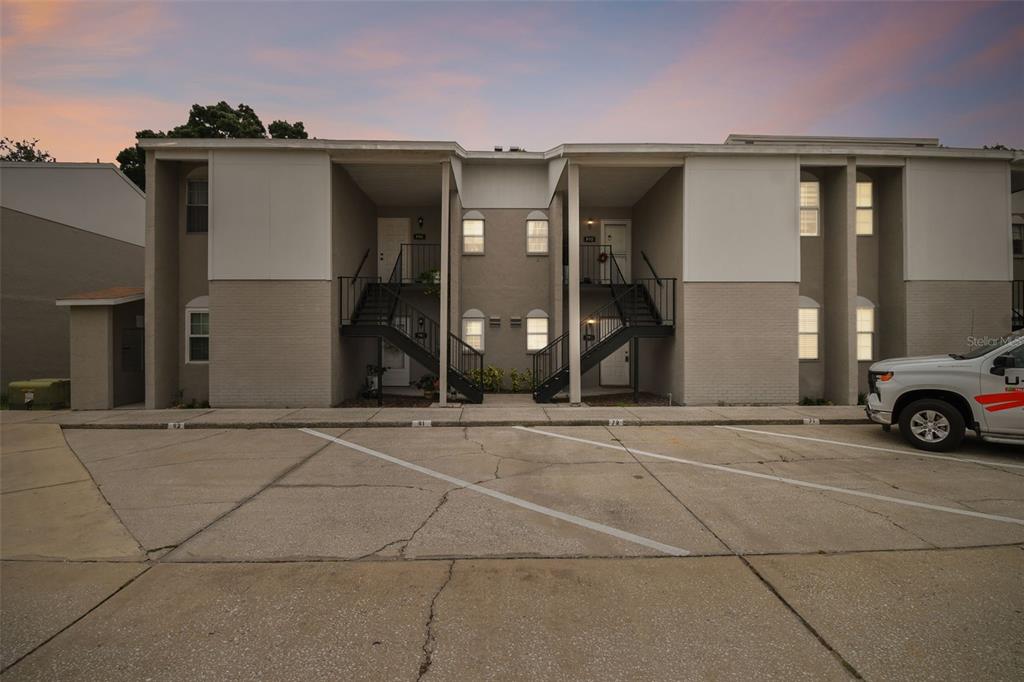 a view of a car park in front of a building